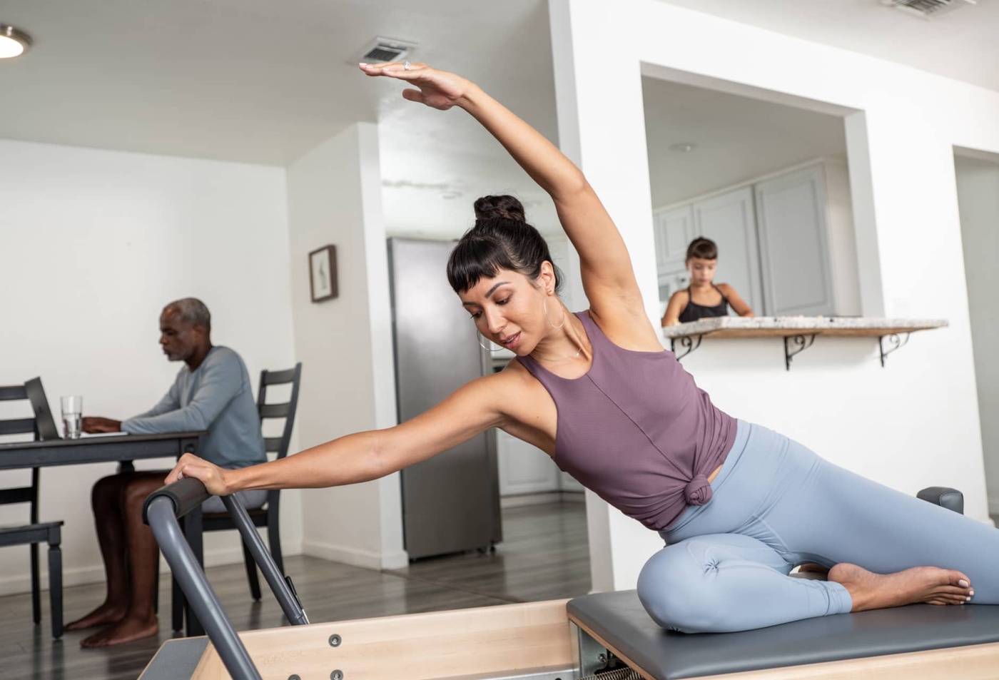 Woman on Reformer in home environment
