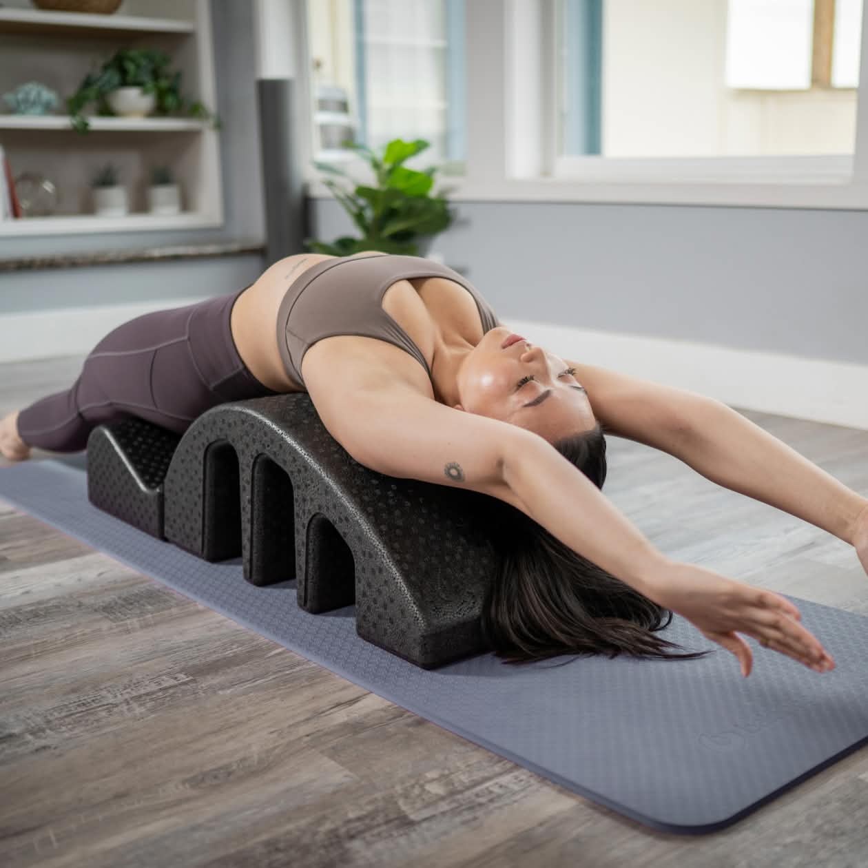 woman on pilates arc