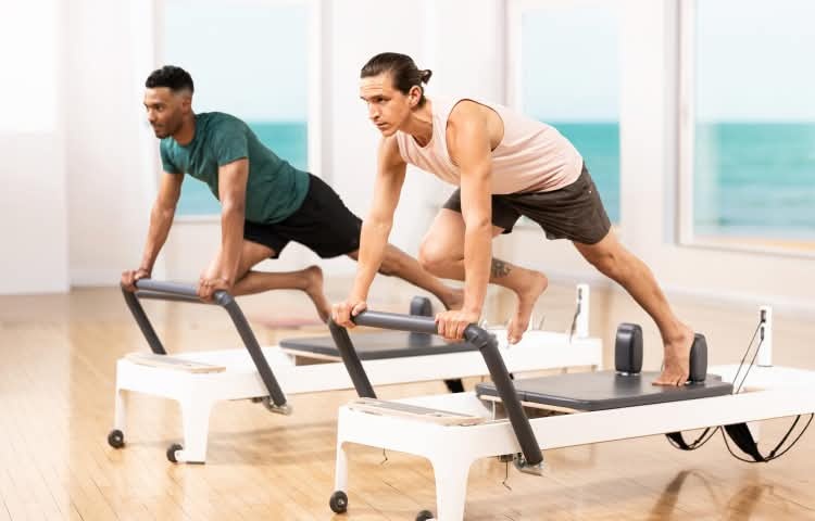 two men on allegro 2 reformers