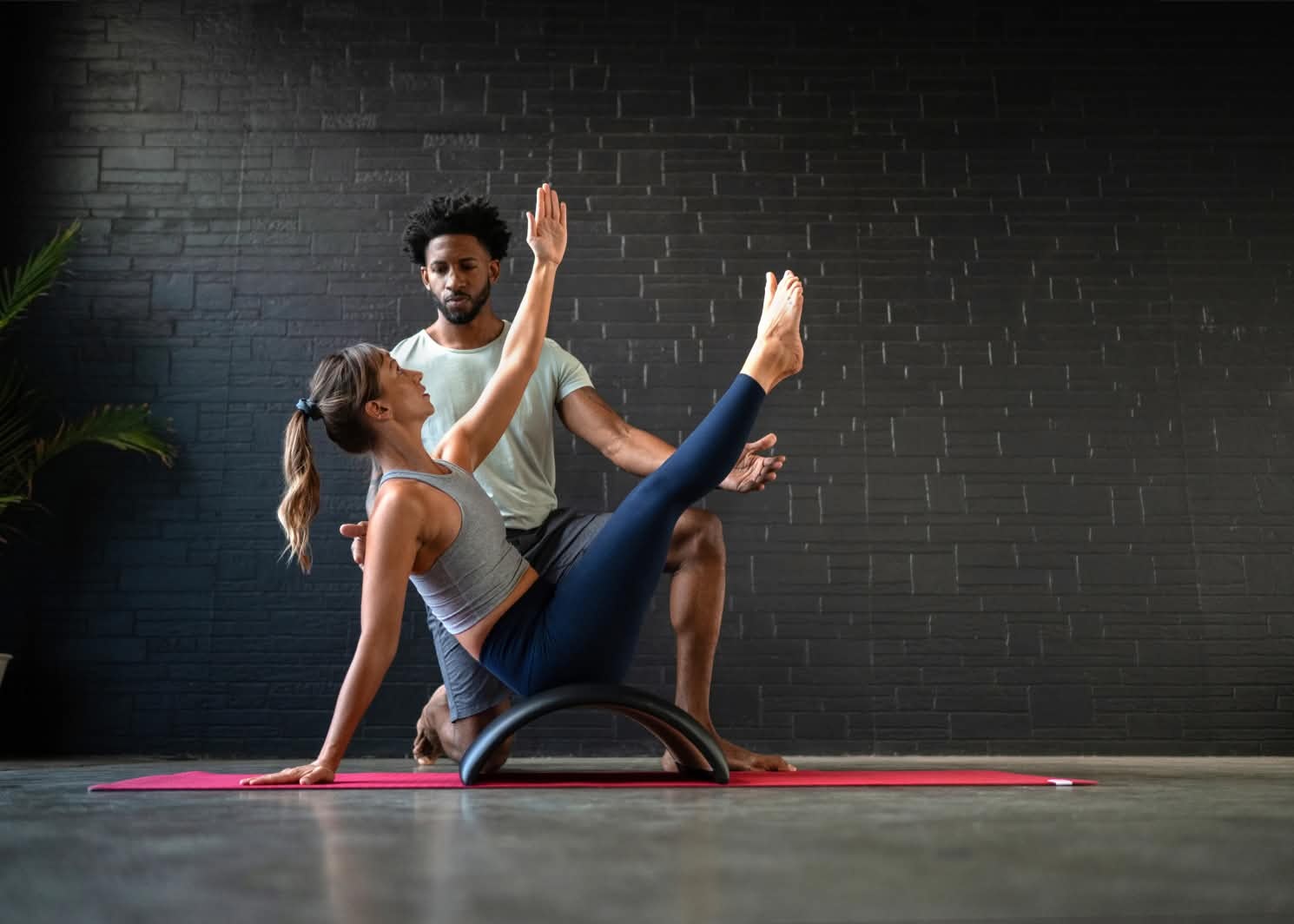 pilates teacher with student