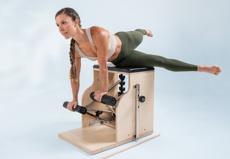 woman using arms on exo chair